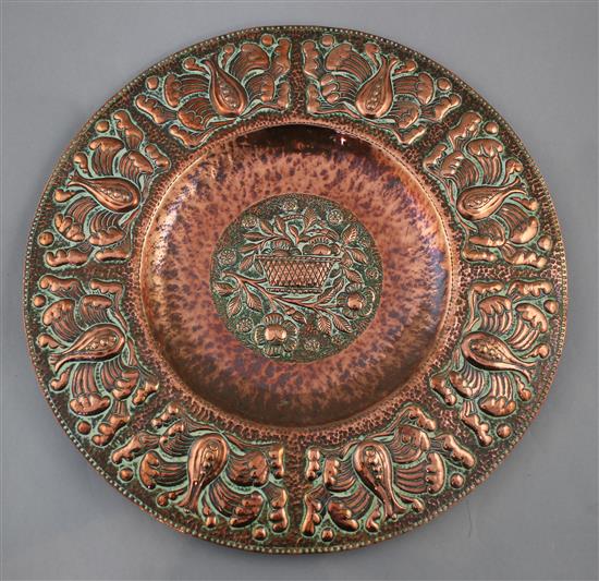 An Arts & Crafts Newlyn circular copper charger, by John Pearson, 15.25in.